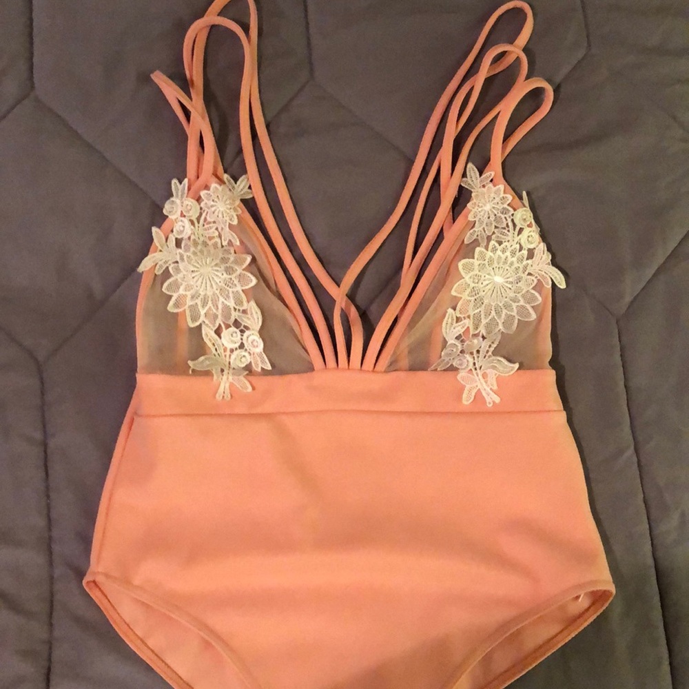 Peach body suit with mesh and cream appliqué